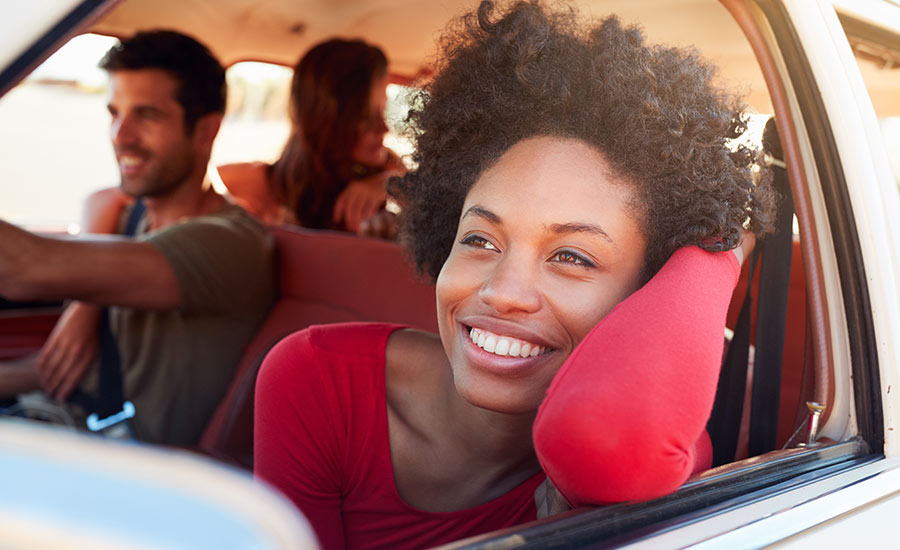 A happy company driving in a car